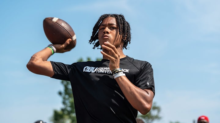 Donald Tabron II, 16, a quarterback at Cass Technical High School, throws a football during a private workout in Detroit on Saturday, June 21, 2025.