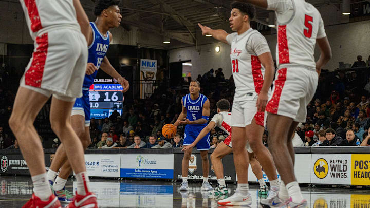 IMG Academy’s Darius Acuff (5) dribbles the ball against an Orchard Lake St. Mary defender at Oakland University in Rochester on Thursday, Jan. 9, 2025. On Saturday, the Arkansas-bound Acuff scored a game-high 32 points and added 11 assists to win MVP honors of the ninth Iverson Classic All-American game in Hampton, Virginia. IMG Academy’s Darius Acuff (5) dribbles the ball against an Orchard Lake St. Mary defender at Oakland University in Rochester on Thursday, Jan. 9, 2025. On Saturday, the Arkansas-bound Acuff scored a game-high 32 points and added 11 assists to win MVP honors of the ninth Iverson Classic All-American game in Hampton, Virginia.