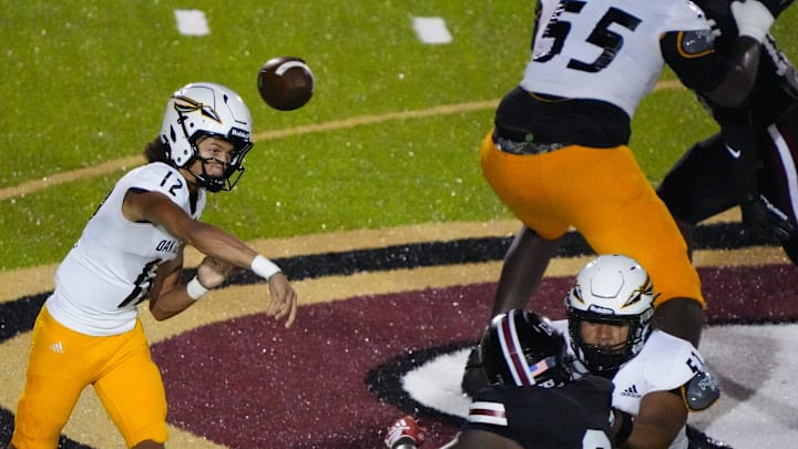 Oak Grove Warriors' quarterback Kellen Hall (12) passes the ball during the game against the Germantown Mavericks in Madison, Miss., on Friday, Sept. 5, 2025.