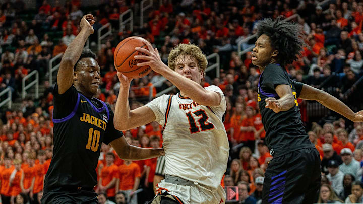 Josh Bascom (12) of Rockford drives to the basket against Auburn Hills Avondale during the MHSAA Division 1 boys basketball semifinal at the Breslin Center in Lansing on Friday, March 13, 2026.