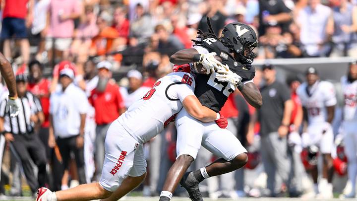 Sep 19, 2026; Nashville, Tennessee, USA; NC State Wolfpack tight end Hunter Provience (86) tackles Vanderbilt Commodores linebacker Bryce Cowan (22) after intercepting a pass during the second half at FirstBank Stadium. Mandatory Credit: Steve Roberts-Imagn Images Sep 19, 2026; Nashville, Tennessee, USA; NC State Wolfpack tight end Hunter Provience (86) tackles Vanderbilt Commodores linebacker Bryce Cowan (22) after intercepting a pass during the second half at FirstBank Stadium. Mandatory Credit: Steve Roberts-Imagn Images