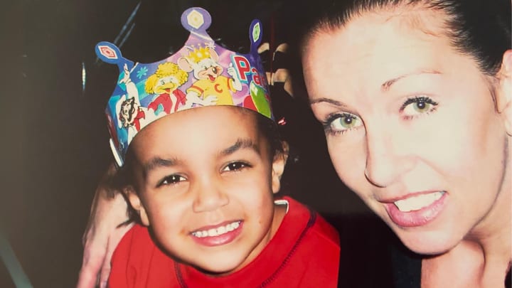 San Antonio Spurs guard Tre Jones poses for a photo with his mother, Debbie, at Chuck E. Cheese.