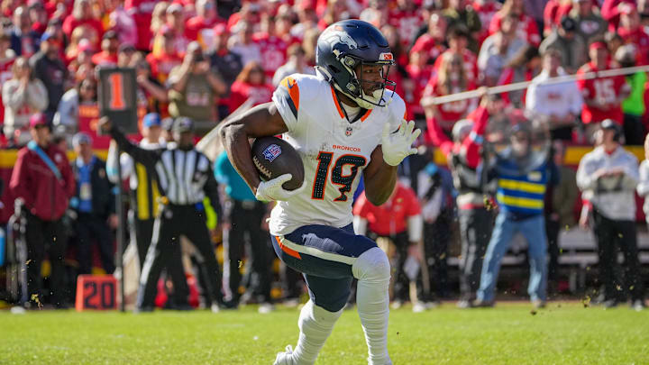 Nov 10, 2024; Kansas City, Missouri, USA; Denver Broncos wide receiver Marvin Mims Jr. (19) runs the ball against the Kansas City Chiefs during the first half at GEHA Field at Arrowhead Stadium. 