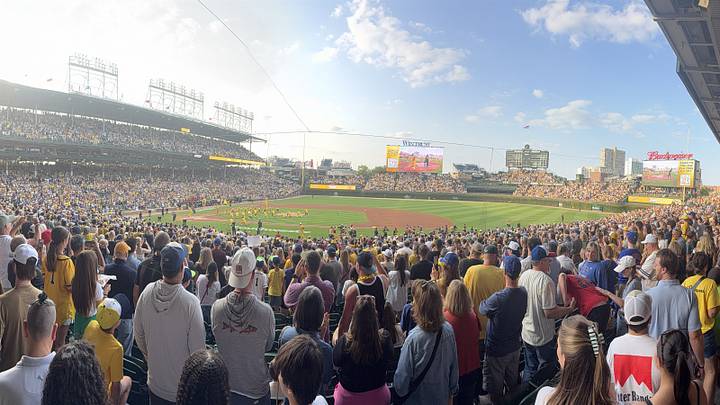 A sold-out crowd watches Banana Ball at Wrigley Field in Chicago, illustrating the Savannah Bananas’ growth from a struggling local team into a national sports phenomenon. A sold-out crowd watches Banana Ball at Wrigley Field in Chicago, illustrating the Savannah Bananas’ growth from a struggling local team into a national sports phenomenon.