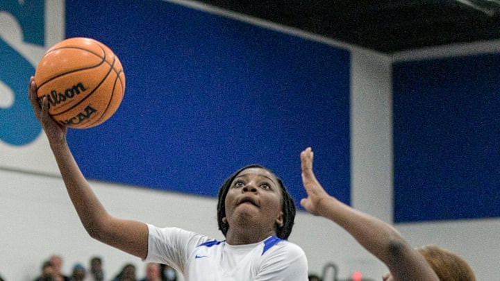 Wildwood's Trinidy Harris (11) tries to score during the Class 1A-Region 4 championship game against Hawthorne High School in Wildwood on Feb. 11, 2022. [PAUL RYAN / CORRESPONDENT]

Wildwood Girls Host Regional Finals Against Hawthorne