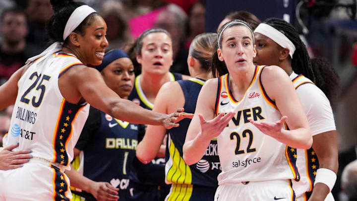 Indiana Fever guard Caitlin Clark (22) talks with an official Thursday, April 30, 2026, during the first half of a preseason game between the Indiana Fever and the Dallas Wings at Gainbridge Fieldhouse in Indianapolis.