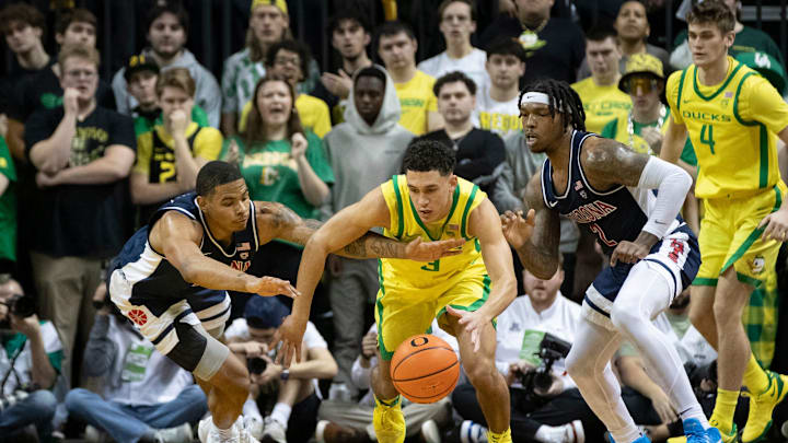 Oregon guard Jackson Shelstad dives after a loose ball as the Oregon Ducks host the Arizona Wildcats Saturday, Jan. 27, 2024 at Matthew Knight Arena in Eugene, Ore.