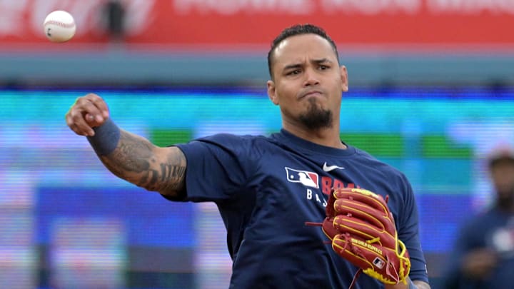 Mar 31, 2025; Los Angeles, California, USA;  Atlanta Braves shortstop Orlando Arcia (11) warms up prior to the game against the Los Angeles Dodgers at Dodger Stadium. Mandatory Credit: Jayne Kamin-Oncea-Imagn Images