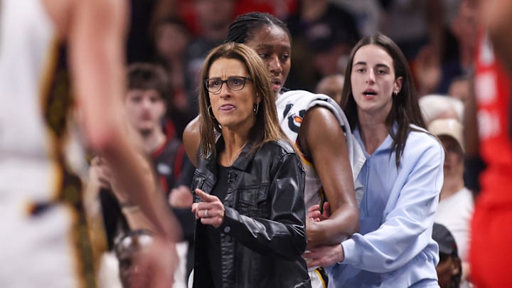 Sep 14, 2025; College Park, Georgia, USA; Indiana Fever head coach Stephanie White reacts after being called for a technical foul as forward Aliyah Boston (7) and guard Caitlin Clark (22) stand behind against the Atlanta Dream in the fourth quarter during game one of round one for the 2025 WNBA Playoffs at Gateway Center Arena at College Park. Mandatory Credit: Brett Davis-Imagn Images
