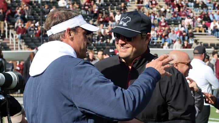 Mississippi Rebels head coach Lane Kiffin greets Mississippi State Bulldogs head coach Jeff Lebby before the game at Davis Wade Stadium at Scott Field.