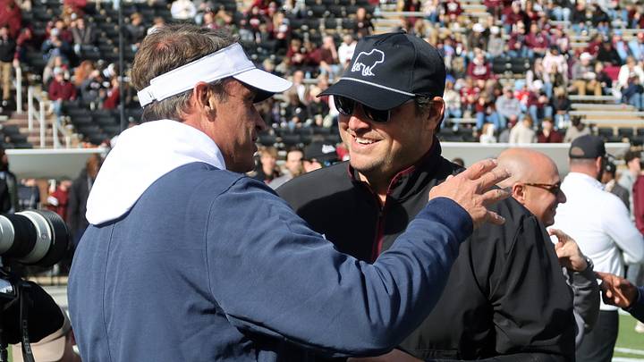 Nov 28, 2025; Starkville, Mississippi, USA; Mississippi Rebels head coach Lane Kiffin greets Mississippi State Bulldogs head coach Jeff Lebby before the game at Davis Wade Stadium at Scott Field. Mandatory Credit: Petre Thomas-Imagn Images Nov 28, 2025; Starkville, Mississippi, USA; Mississippi Rebels head coach Lane Kiffin greets Mississippi State Bulldogs head coach Jeff Lebby before the game at Davis Wade Stadium at Scott Field. Mandatory Credit: Petre Thomas-Imagn Images