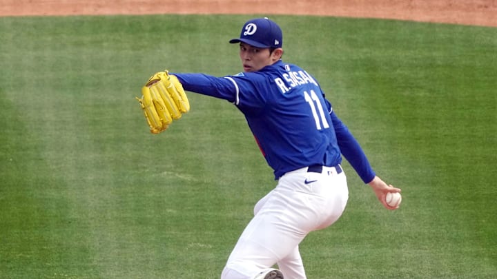 Mar 11, 2025; Phoenix, Arizona, USA; Los Angeles Dodgers pitcher Roki Sasaki (11) throws against the Cleveland Guardians in the third inning at Camelback Ranch-Glendale. Mandatory Credit: Rick Scuteri-Imagn Images Mar 11, 2025; Phoenix, Arizona, USA; Los Angeles Dodgers pitcher Roki Sasaki (11) throws against the Cleveland Guardians in the third inning at Camelback Ranch-Glendale. Mandatory Credit: Rick Scuteri-Imagn Images