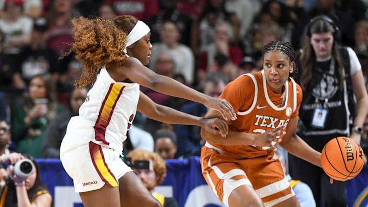 South Carolina Gamecocks guard Raven Johnson (25) defends Texas Longhorns forward Madison Booker (35) Sunday, March 8, 2026, during the SEC Women's Basketball Tournament Championship game at Bon Secours Wellness Arena in Greenville, South Carolina.