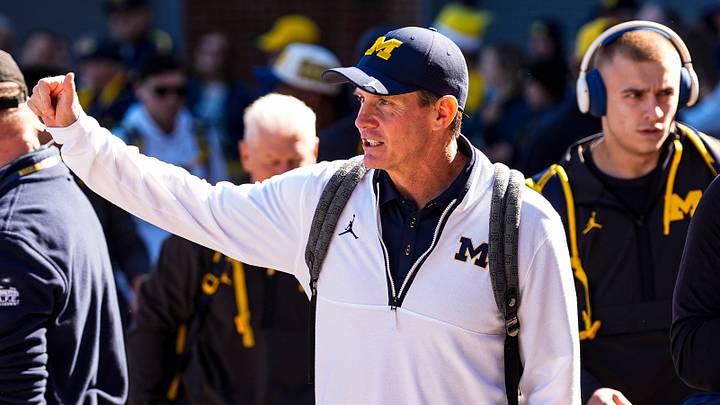 Michigan defensive coordinator Jay Hill waves at fans as the team arrives ahead of the game between Michigan and Penn State at Michigan Stadium in Ann Arbor on Saturday, Oct. 17, 2026.