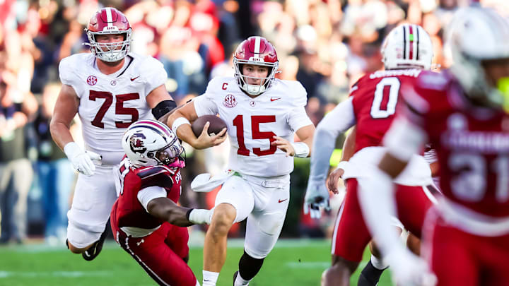 Oct 25, 2025; Columbia, South Carolina, USA; Alabama Crimson Tide quarterback Ty Simpson (15) scrambles for a first down on fourth down against the South Carolina Gamecocks in the second quarter at Williams-Brice Stadium. Mandatory Credit: Jeff Blake-Imagn Images