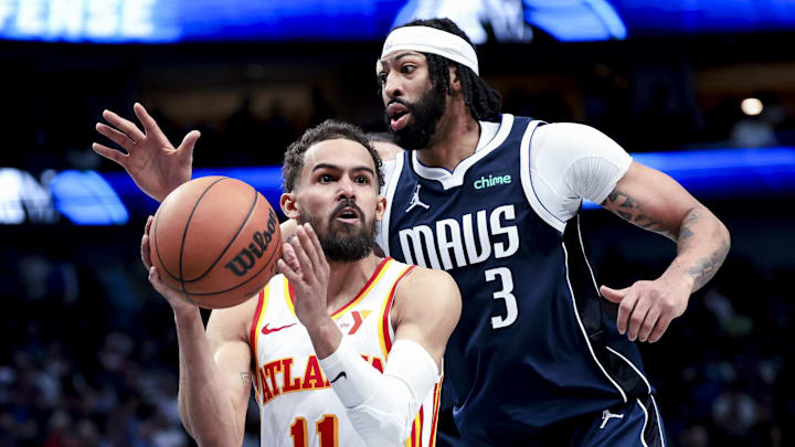 Atlanta Hawks guard Trae Young looks to pass as Dallas Mavericks forward Anthony Davis.