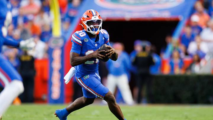 Nov 29, 2025; Gainesville, Florida, USA; Florida Gators running back Duke Clark (20) runs against the Florida State Seminoles during the first half at Ben Hill Griffin Stadium. Mandatory Credit: Matt Pendleton-Imagn Images