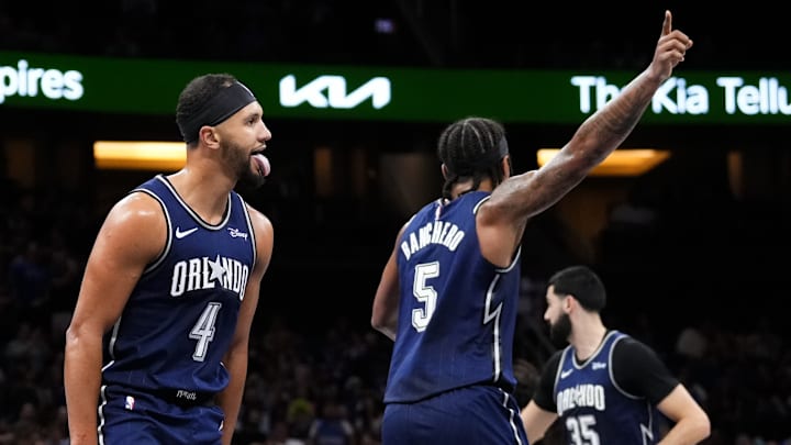 Jalen Suggs (left) and Paolo Ranchero (right) celebrate against the Toronto Raptors