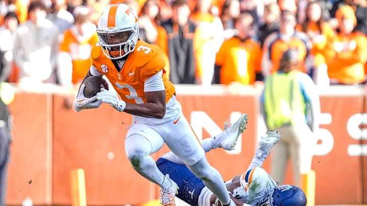 Nov 23, 2024; Knoxville, Tennessee, USA; Tennessee Volunteers wide receiver Squirrel White (3) escapes a tackle against the UTEP Miners at Neyland Stadium. Mandatory Credit: Brianna Paciorka/USA TODAY Network via Imagn Images