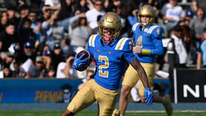 Nov 30, 2024; Pasadena, California, USA; UCLA Bruins wide receiver Titus Mokiao-Atimalala runs upfield after catching a short pass from UCLA Bruins quarterback Ethan Garbers (4) during the section quarter against the Fresno State Bulldogs at Rose Bowl. Mandatory Credit: Robert Hanashiro-Imagn Images