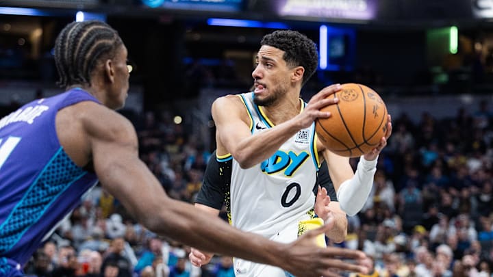 Apr 2, 2025; Indianapolis, Indiana, USA; Indiana Pacers guard Tyrese Haliburton (0) shoots the ball while Charlotte Hornets forward Moussa Diabate (14) defends in the second half at Gainbridge Fieldhouse. Mandatory Credit: Trevor Ruszkowski-Imagn Images