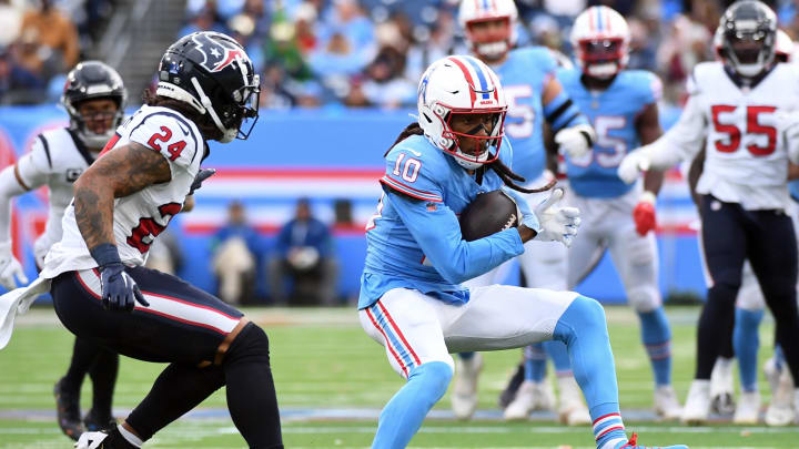 Dec 17, 2023; Nashville, Tennessee, USA; Tennessee Titans wide receiver DeAndre Hopkins (10) runs after a catch during the second half against the Houston Texans at Nissan Stadium. Mandatory Credit: Christopher Hanewinckel-USA TODAY Sports Dec 17, 2023; Nashville, Tennessee, USA; Tennessee Titans wide receiver DeAndre Hopkins (10) runs after a catch during the second half against the Houston Texans at Nissan Stadium. Mandatory Credit: Christopher Hanewinckel-USA TODAY Sports
