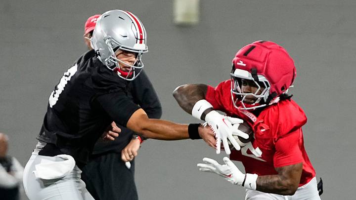 Ohio State Buckeyes quarterback Tavien St. Clair (9) hands off to running back Legend Bey (2) during the first day of spring workouts for the 2026 football season at Woody Hayes Athletic Complex in Columbus on March 10, 2026. Ohio State Buckeyes quarterback Tavien St. Clair (9) hands off to running back Legend Bey (2) during the first day of spring workouts for the 2026 football season at Woody Hayes Athletic Complex in Columbus on March 10, 2026.
