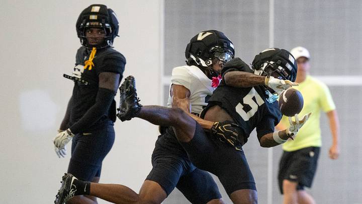 Vanderbilt wide receiver Tristen Brown (5) makes a catch while covered cornerback Jaylin Lackey (2) during preseason practice at the school’s indoor facility Friday, Aug. 14, 2026.