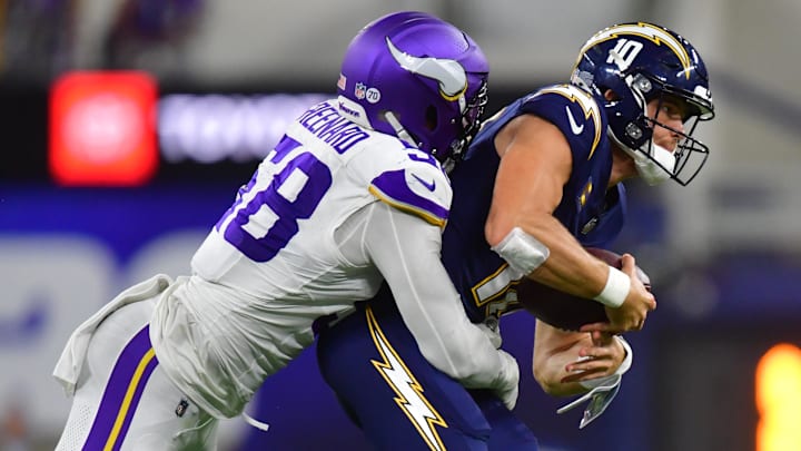 Oct 23, 2025; Inglewood, California, USA; Minnesota Vikings linebacker Jonathan Greenard (58) gets pressure on Los Angeles Chargers quarterback Justin Herbert (10) during the first half at SoFi Stadium. Mandatory Credit: Gary A. Vasquez-Imagn Images