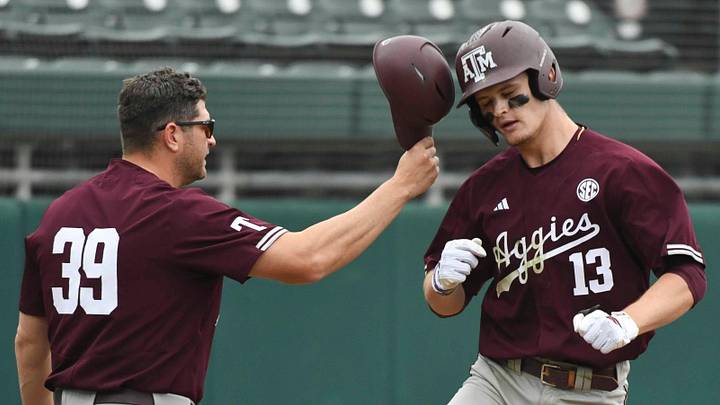 April 19, 2024; Tuscaloosa, AL, USA; Texas A&M assistant coach Nolan Cain congratulates Caden Sorrell as he rounds third after hitting a grand slam against Alabama at Sewell-Thomas Stadium in the first game of a double header Friday.