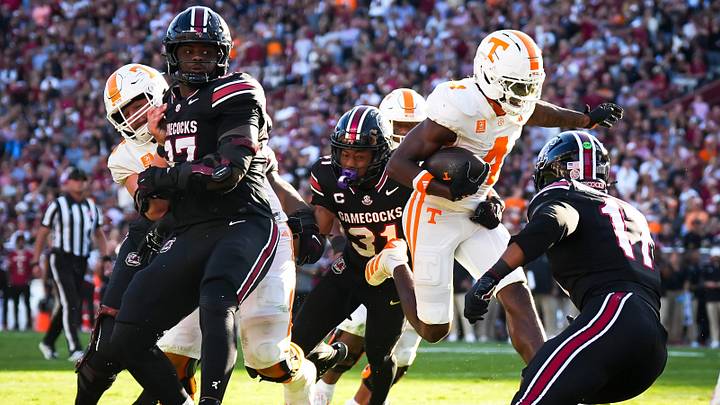 Tennessee wide receiver Mike Matthews (4) escapes tackles on his way to the end zone for a touchdown during a college football game between Tennessee and South Carolina at Williams-Brice Stadium in Columbia, S.C., on Oct. 24, 2026. Tennessee wide receiver Mike Matthews (4) escapes tackles on his way to the end zone for a touchdown during a college football game between Tennessee and South Carolina at Williams-Brice Stadium in Columbia, S.C., on Oct. 24, 2026.