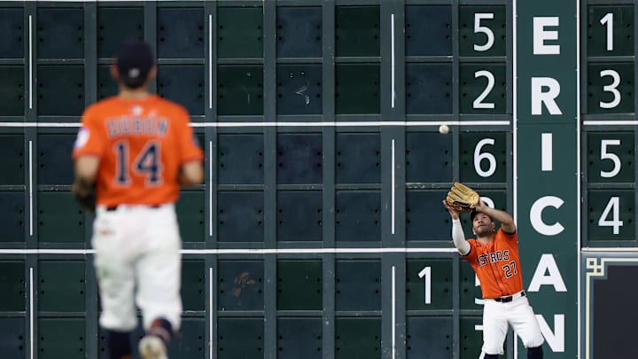Jul 12, 2025; Houston, Texas, USA; Houston Astros left fielder Jose Altuve (27) catches a Texas Rangers fly ball for an out  in the seventh  inning at Daikin Park. Mandatory Credit: Thomas Shea-Imagn Image