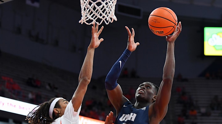 Nov 6, 2023; Syracuse, New York, USA; New Hampshire Wildcats forward Clarence Daniels (21) shoots against Syracuse. 