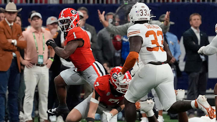 Georgia running back Trevor Etienne (1) moves the ball during the first half of the SEC championship game against Texas in Atlanta, on Saturday, Dec. 7, 2024.