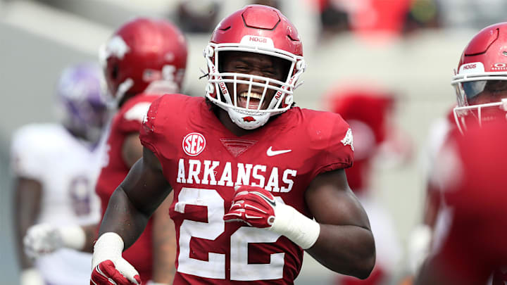 Sep 2, 2023; Little Rock, Arkansas, USA; Arkansas Razorbacks linebacker Brad Spence (22) celebrates after returning an interception for a touchdown in the fourth quarter against the Western Carolina Catamounts at War Memorial Stadium. Arkansas won 56-13. Mandatory Credit: Nelson Chenault-Imagn Images