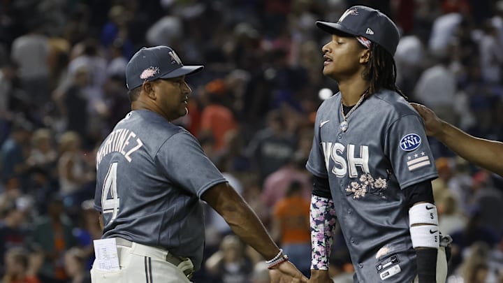 Jul 22, 2023; Washington, District of Columbia, USA; Washington Nationals manager Dave Martinez (4) celebrates with Nationals shortstop CJ Abrams (5) after their game San Francisco Giants at Nationals Park.