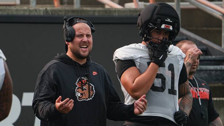 Oregon State offensive line coach Kirk Barron, left, leads drills during fall camp at Reser Stadium on Wednesday, Aug. 5, 2025, in Corvallis, Oregon. Oregon State offensive line coach Kirk Barron, left, leads drills during fall camp at Reser Stadium on Wednesday, Aug. 5, 2025, in Corvallis, Oregon.
