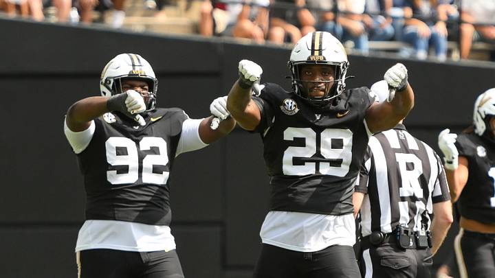 Sep 27, 2025; Nashville, Tennessee, USA; Vanderbilt Commodores defensive lineman Jaylon Stone (92) and edge Miles Capers (29) celebrate the sack of Utah State Aggies quarterback Bryson Barnes (16) during the first half at FirstBank Stadium. Mandatory Credit: Steve Roberts-Imagn Images Sep 27, 2025; Nashville, Tennessee, USA; Vanderbilt Commodores defensive lineman Jaylon Stone (92) and edge Miles Capers (29) celebrate the sack of Utah State Aggies quarterback Bryson Barnes (16) during the first half at FirstBank Stadium. Mandatory Credit: Steve Roberts-Imagn Images
