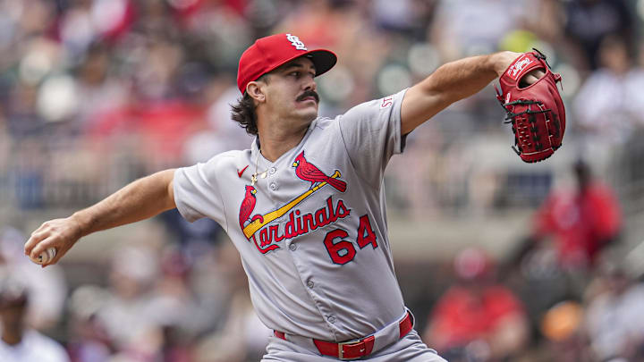 Apr 23, 2025; Cumberland, Georgia, USA; St. Louis Cardinals pitcher Ryan Fernandez (64) pitches against the Atlanta Braves during the eighth inning at Truist Park. Mandatory Credit: Dale Zanine-Imagn Images Apr 23, 2025; Cumberland, Georgia, USA; St. Louis Cardinals pitcher Ryan Fernandez (64) pitches against the Atlanta Braves during the eighth inning at Truist Park. Mandatory Credit: Dale Zanine-Imagn Images