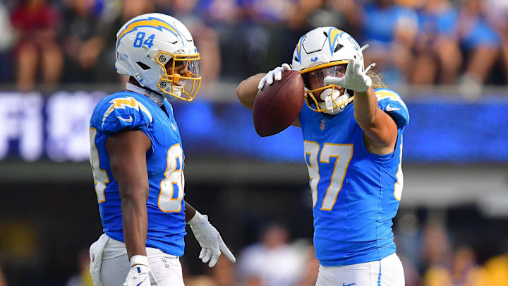 Aug 17, 2024; Inglewood, California, USA; Los Angeles Chargers wide receiver Simi Fehoko (87) reacts after catching a pass against the Los Angeles Rams with tight end Stone Smartt (84) during the first half at SoFi Stadium.