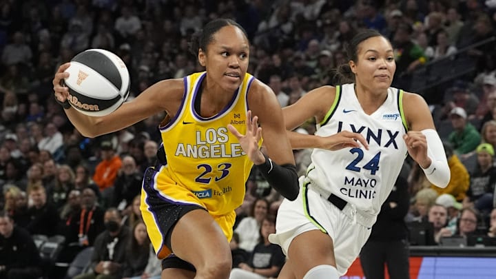 Jun 14, 2025; Minneapolis, Minnesota, USA; Los Angeles Sparks center Azurá Stevens (23) goes to the basket past Minnesota Lynx forward Napheesa Collier (24) in the first quarter at Target Center. Mandatory Credit: Bruce Kluckhohn-Imagn Images Jun 14, 2025; Minneapolis, Minnesota, USA; Los Angeles Sparks center Azurá Stevens (23) goes to the basket past Minnesota Lynx forward Napheesa Collier (24) in the first quarter at Target Center. Mandatory Credit: Bruce Kluckhohn-Imagn Images