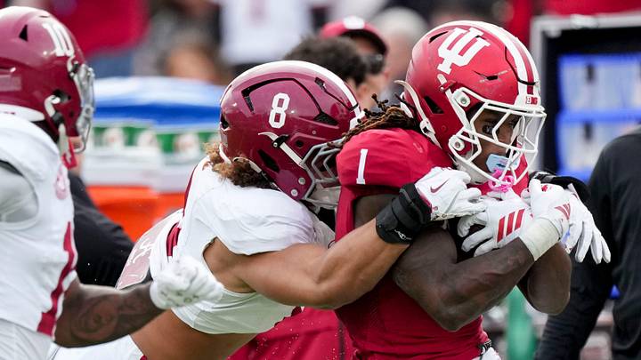Alabama Crimson Tide linebacker Justin Hill (8) works to stop Indiana Hoosiers running back Roman Hemby (1) as he rushes the ball Thursday, Jan. 1, 2026, during the Rose Bowl and quarterfinal game of the College Football Playoff at Rose Bowl Stadium in Pasadena, Calif. Alabama Crimson Tide linebacker Justin Hill (8) works to stop Indiana Hoosiers running back Roman Hemby (1) as he rushes the ball Thursday, Jan. 1, 2026, during the Rose Bowl and quarterfinal game of the College Football Playoff at Rose Bowl Stadium in Pasadena, Calif.