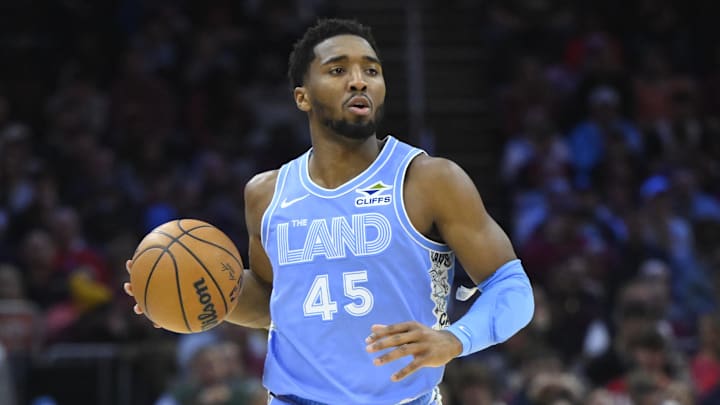 Dec 23, 2024; Cleveland, Ohio, USA; Cleveland Cavaliers guard Donovan Mitchell (45) brings the ball up court in the first quarter against the Utah Jazz at Rocket Mortgage FieldHouse. Mandatory Credit: David Richard-Imagn Images