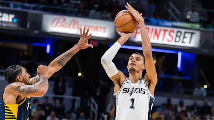 Nov 6, 2023; Indianapolis, Indiana, USA; San Antonio Spurs center Victor Wembanyama (1) shoots the ball while Indiana Pacers forward Obi Toppin (1) defends in the second half at Gainbridge Fieldhouse.