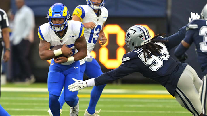 Aug 9, 2025; Inglewood, California, USA;  Los Angeles Rams running back Jarquez Hunter (35) carries the ball past Dallas Cowboys linebacker James Houston (53) during the second half at SoFi Stadium. Mandatory Credit: Jayne Kamin-Oncea-Imagn Images