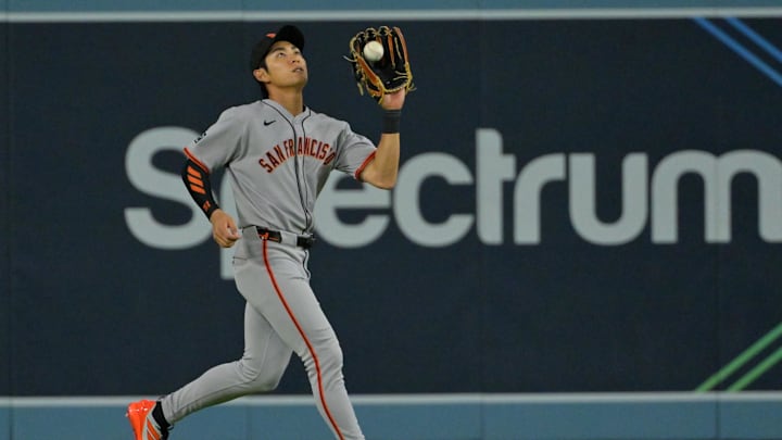 Sep 20, 2025; Los Angeles, California, USA;  San Francisco Giants center fielder Jung Hoo Lee (51) makes an out in the eighth inning against the Los Angeles Dodgers at Dodger Stadium. Mandatory Credit: Jayne Kamin-Oncea-Imagn Images