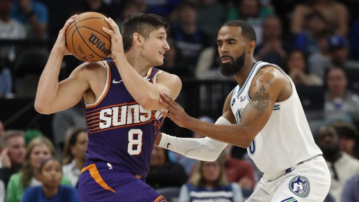 Apr 14, 2024; Minneapolis, Minnesota, USA; Phoenix Suns guard Grayson Allen (8) works around