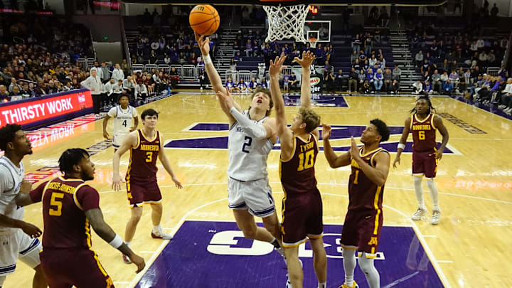 Jan 3, 2026; Evanston, Illinois, USA: Northwestern Wildcats forward Nick Martinelli (2) shoots the ball over Minnesota Golden Gophers forward Cade Tyson (10) during the second half at Welsh-Ryan Arena. Mandatory Credit: David Banks-Imagn Images