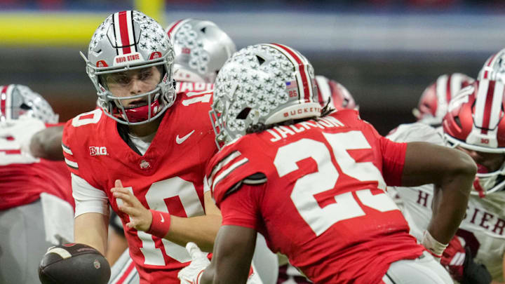 Ohio State Buckeyes quarterback Julian Sayin (10) looks to hand the ball off to Ohio State Buckeyes running back Bo Jackson (25) on Saturday, Dec. 6, 2025, during the Big Ten football championship at Lucas Oil Stadium in Indianapolis. Ohio State Buckeyes quarterback Julian Sayin (10) looks to hand the ball off to Ohio State Buckeyes running back Bo Jackson (25) on Saturday, Dec. 6, 2025, during the Big Ten football championship at Lucas Oil Stadium in Indianapolis.