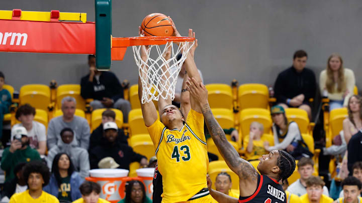Mar 7, 2026; Waco, Texas, USA; Baylor Bears guard Cameron Carr (43) dunks the ball against Utah Utes forward Kendyl Sanders (13) during the second half at Paul and Alejandra Foster Pavilion. Mandatory Credit: Chris Jones-Imagn Images Mar 7, 2026; Waco, Texas, USA; Baylor Bears guard Cameron Carr (43) dunks the ball against Utah Utes forward Kendyl Sanders (13) during the second half at Paul and Alejandra Foster Pavilion. Mandatory Credit: Chris Jones-Imagn Images